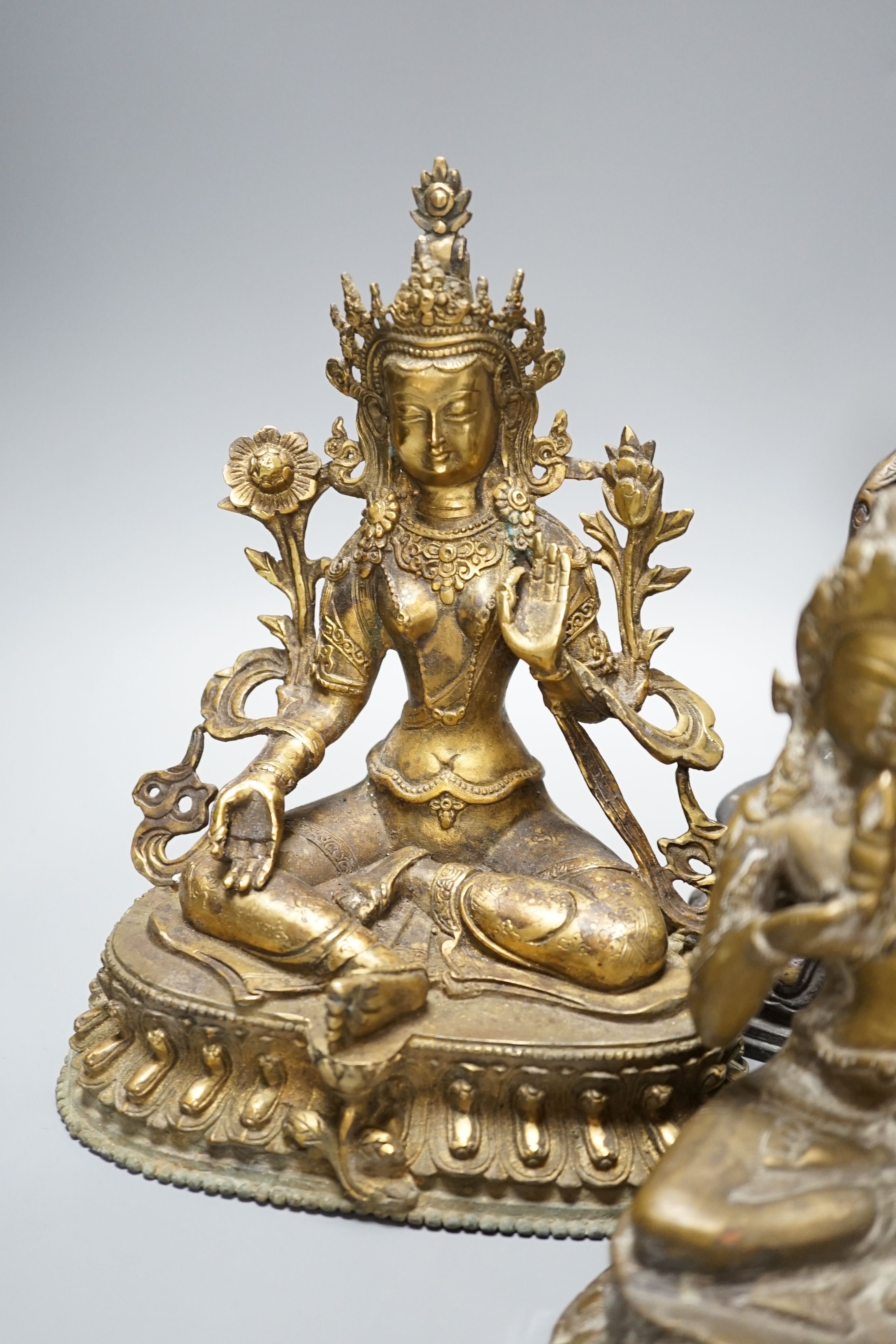 A group of five Tibetan or buddhist bronzes of deities and a Chinese bronze ‘dragon’ vase, tallest 21cm